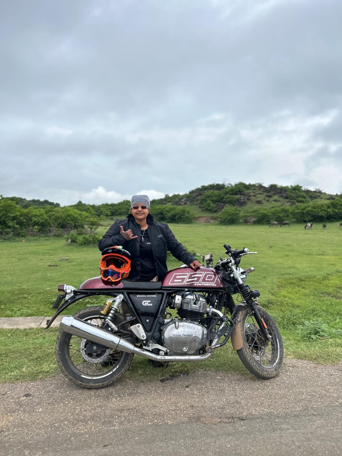Saloni, co-founder of HOGS, on her motorcycle in the mountains